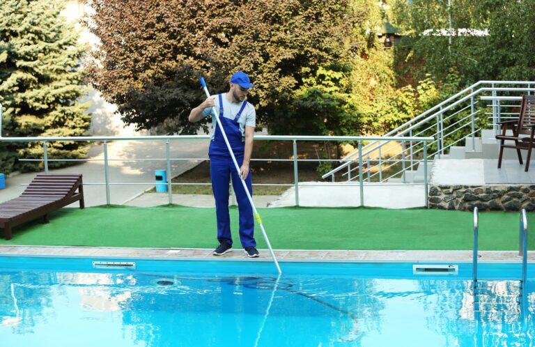 man cleaning pool-sm